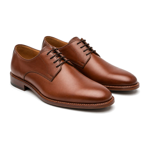 Pair of Kingsbridge brown leather Derby shoes with open lacing, three-quarter view showing the welted sole
