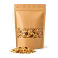 Kraft pouch of Australian honey muesli with a window showing oat flakes, seeds, nuts and dried fruit, with a scattering of muesli in front